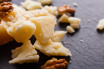 fragrant Parmesan on a slate stone slicing board