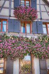 Fototapeta na wymiar Obernai, France. October 14, 2018. House with flowers. Details