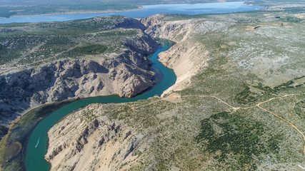 Fototapeta premium Zrmanja River in northern Dalmatia, Croatia is famous for its crystal clear waters and countless waterfalls surrounded by a deep canyon. This was a site of winnetou filming.