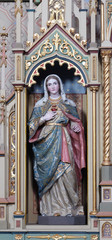 Obraz premium Immaculate heart of Mary statue on the Sacred heart of Jesus altar in the church of Saint Matthew in Stitar, Croatia 