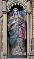Obraz premium Immaculate heart of Mary statue on the Sacred heart of Jesus altar in the church of Saint Matthew in Stitar, Croatia 