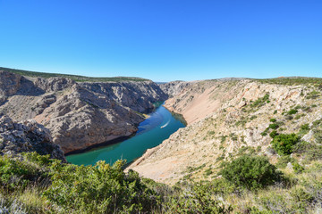 Obraz premium Zrmanja River in northern Dalmatia, Croatia is famous for its crystal clear waters and countless waterfalls surrounded by a deep canyon. This was a site of winnetou filming.