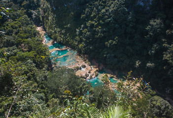 Aerial view of the beautiful, turquoise natural pools of Semuc Champey, a popular tourism destination in Guatemala