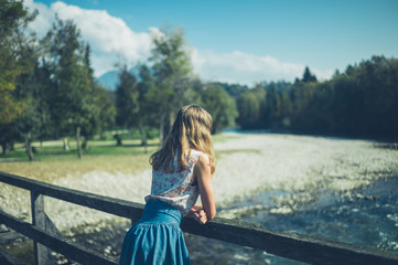 Young woman standing on bridge