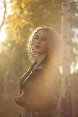 girl in a dress among birches