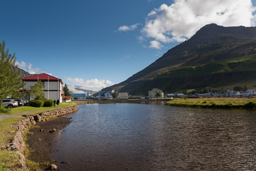 Fototapeta na wymiar Iceland (Summer), homes at enchanting fjord of Seydisfjordur