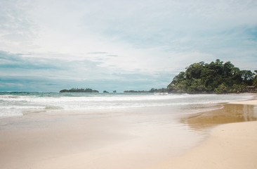 Windy day on the wide white sand of Red Frog Beach, a Caribbean island off the coast of Panama