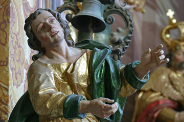 Saint John the Evangelist statue on the pulpit in the Baroque Church of Our Lady of the Snow in Belec, Croatia 