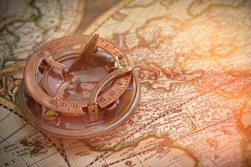 old map and compass , navigation and geography 