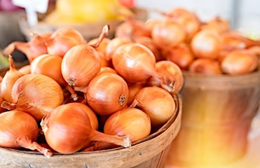 Onions and healthy vegetables at local market .