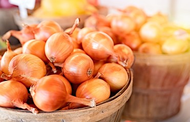 Onions and healthy vegetables at local market .