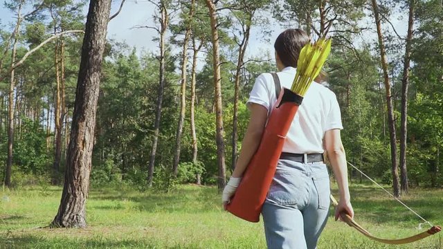 Girl archer going through the forest