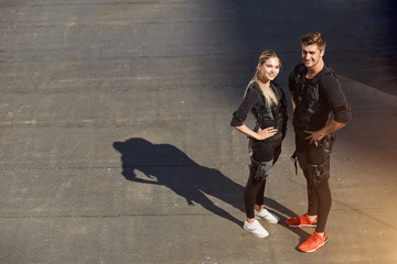 couple is ready for cross fit training with EMS. favourite hobby. common interests with a girlfriend. top view full length photo. copy space
