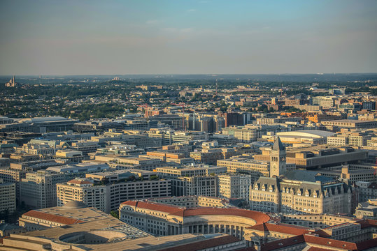 Arial view (above) of Downtown Washington, DC Government departments buildings from National Monument during Sunset evening time. Government departments buildings.