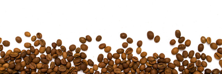 Coffee grains in the bottom of the image on a isolated white bac