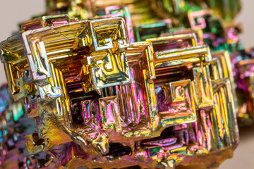 Macro of the mineral bismuth stone on a white background