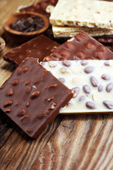 Chocolate bars on table with chocolate tower.