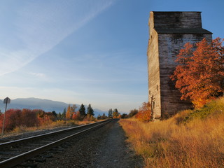 Fototapeta na wymiar Grain elevators in autumn as the sun sets