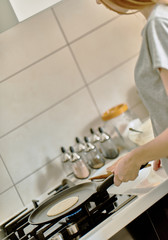 Pancake is fried in a skillet.