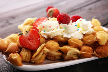 Hong Kong style egg waffle on wooden board. bubble waffle