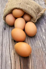 Fresh egg roll down on wooden table. Food ingredient.