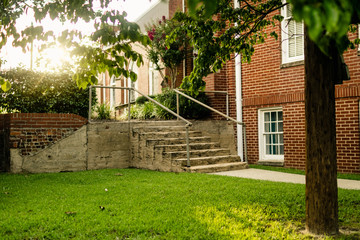 Fototapeta na wymiar Walkway and Stairs Outside a Brick Church Building