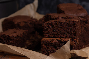 Slices of chocolate brownie on brown paper
