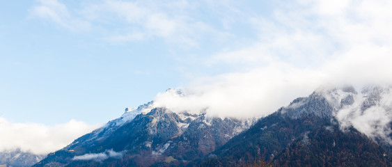 Panoramic view of the Swiss Alps against moody clouds above