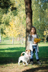 Happy kids with dog in park