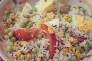 salad of rice, tomato, peas and egg -  closeup vintage