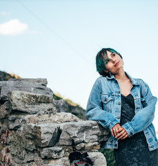 Naklejka premium A young woman enjoys a walk through the old historic town.