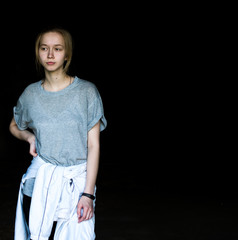 Young girl in a dark cave.