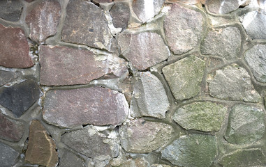 Texture of a stone wall. Old castle stone wall texture background. Part of a stone wall, for background or texture.
