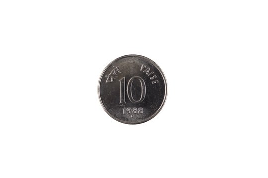 An extreme close up of an Indian ten paise coin on a solid white background