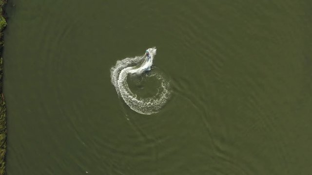 Overhead view of someone jet skiing and doing doughnuts in the Delta in Antioch Northern California