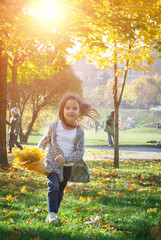 beautiful little girl happy having fun in the park