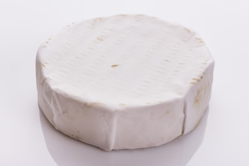delicious creamy camembert cheese on a white background