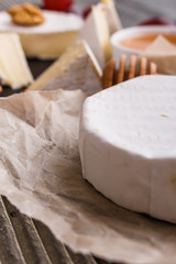 delicious creamy camembert cheese on a wooden rustic background