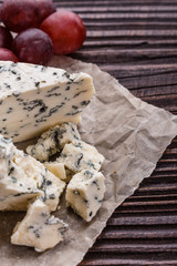 delicious blue cheese on wooden rustic background