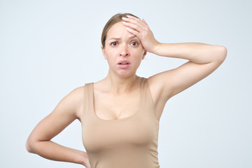 Obraz premium Sad woman serious and concerned looking worried and thoughtful facial expression feeling depressed