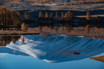 Mongolia Altai lake in autumn at sunrise - mountain reflexion