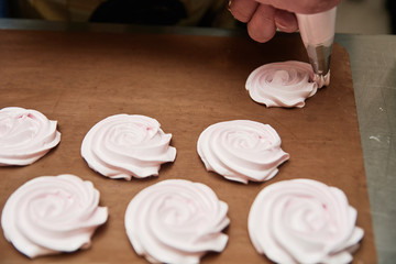 Process of making meringue pavlova dessert Food industry, mass or volume production. pastry chef making dessert