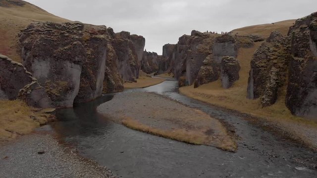 Cinematic aerial flyover of stunning Icelandic canyon.