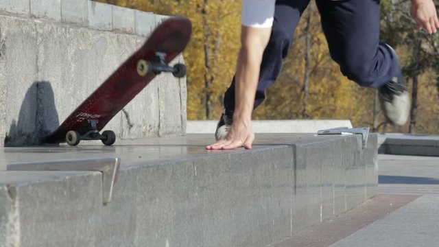 Skateboarder try a grind trick on ledge and falling down, slowmotion