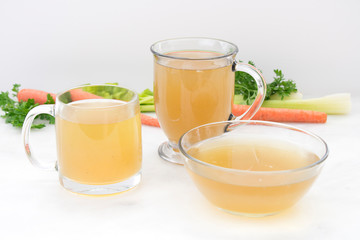 Chicken Stock in Glass Mugs and Bowl