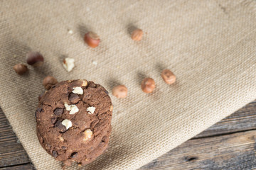 Soft dark chocolate brownie cookies on wood