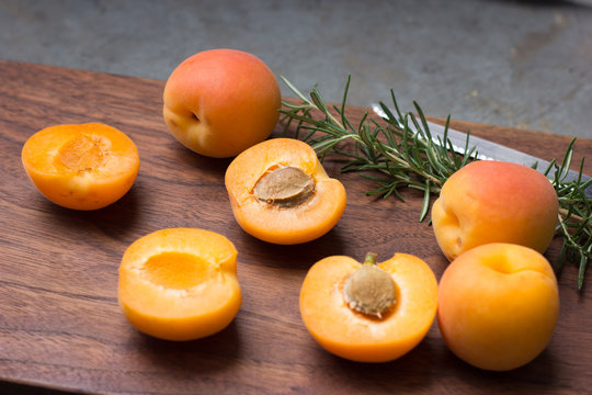 Apricots on wooden board
