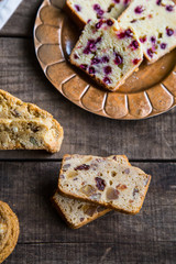 Holiday fruitcake slices with other desserts on wood