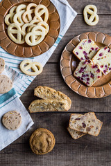 Holiday cookies and cakes on wood surface