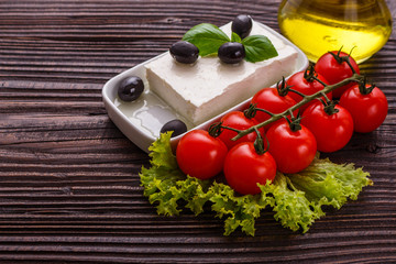 A piece of feta cheese on a wooden rustic background